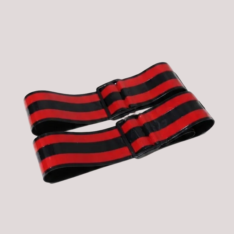 A black and red horizontally striped elastic belt with a black buckle, displayed on a light gray background.