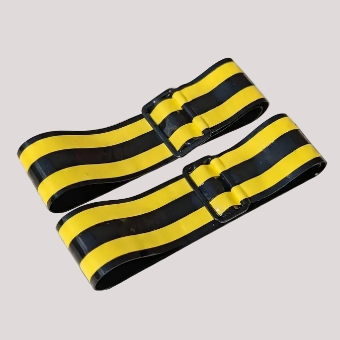 Two black and yellow striped elastic bands with adjustable black plastic buckles, displayed on a light gray background.